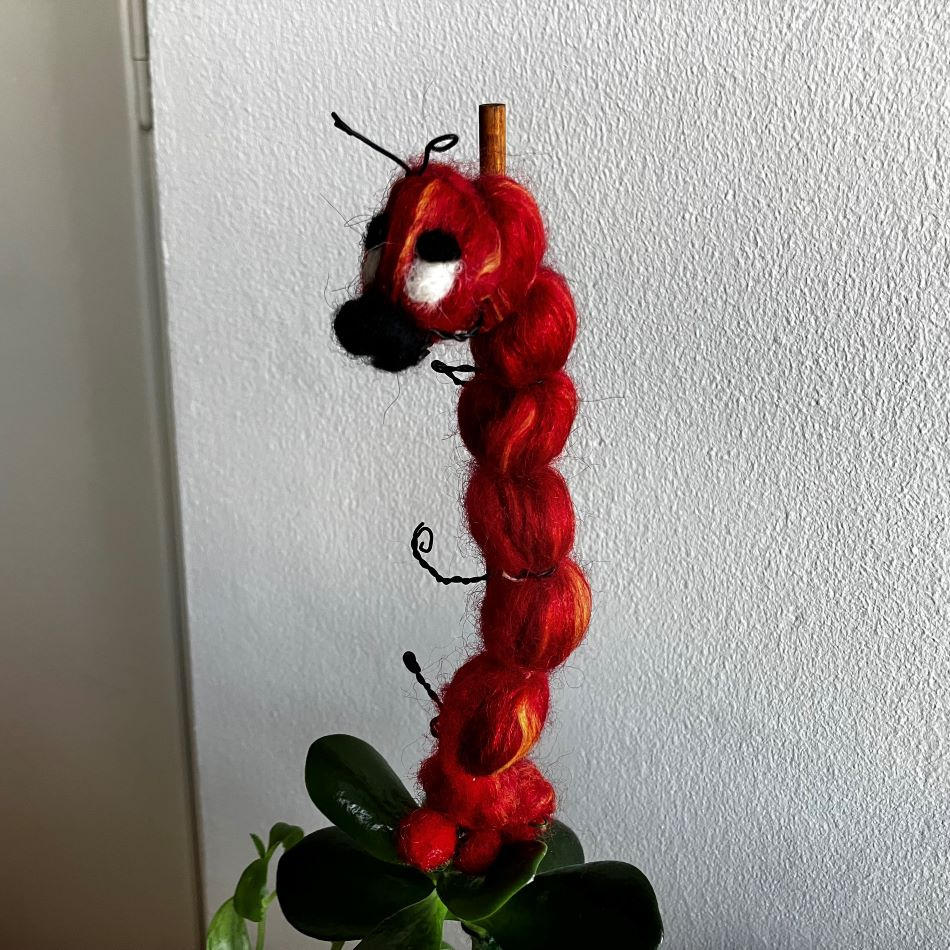Ulldekoration-röd insekt